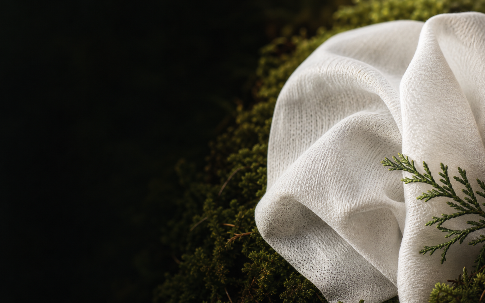 Macro view of a soft white wipe with visible plant-based fiber texture